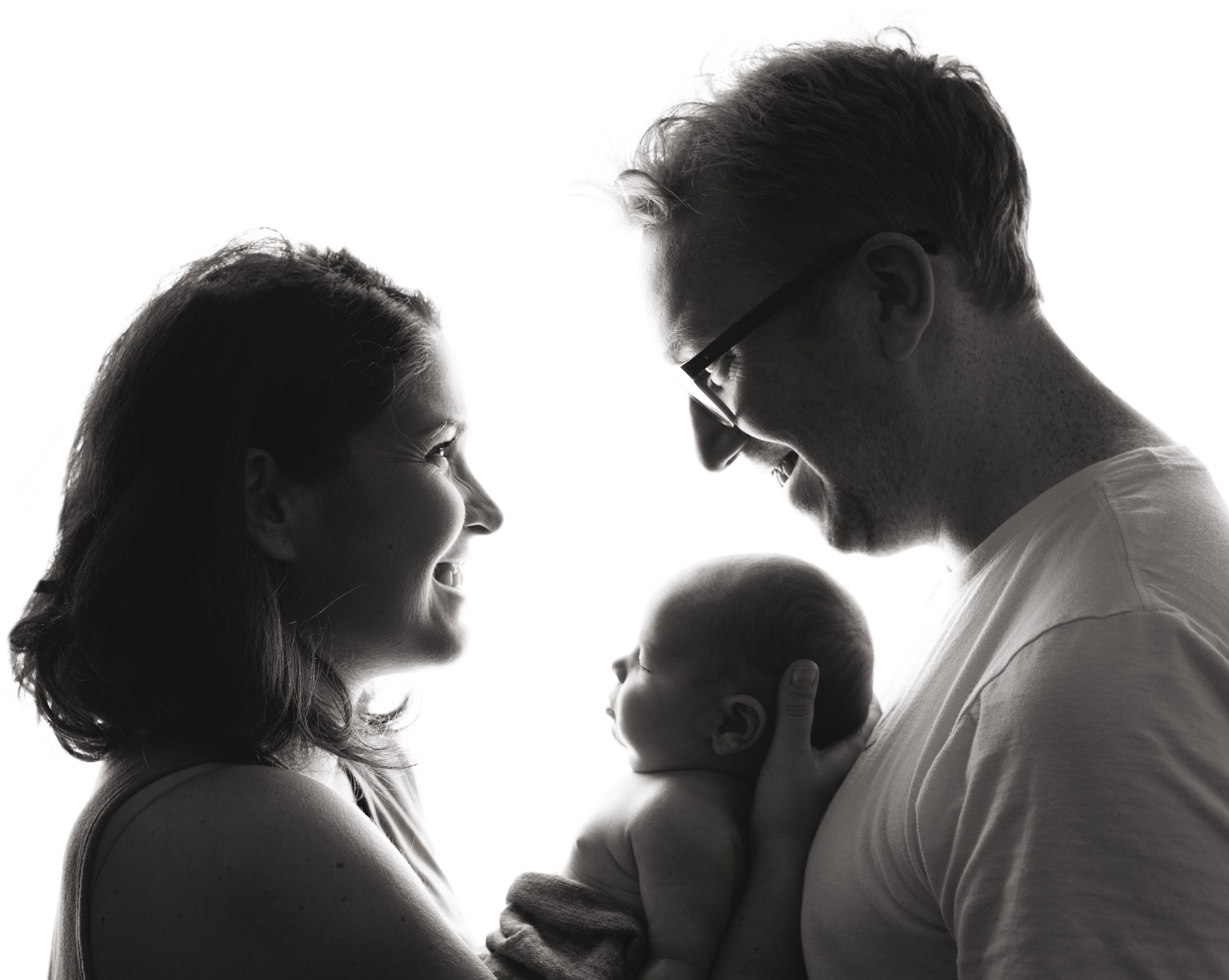 Black and white image of mum dad and newborn baby boy by Newborn photographer Stowmarket Suffolk