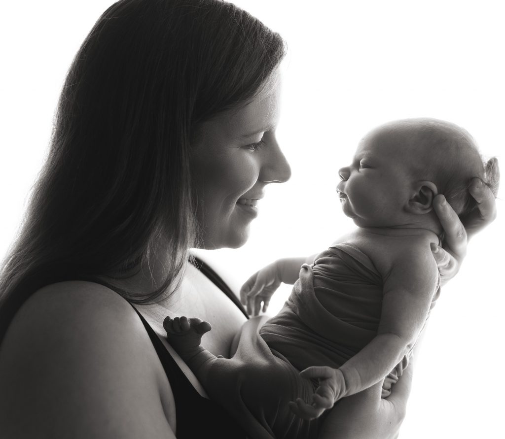 black and white image of mum and newborn baby by Newborn Photographer In Great Finborough, Near Stowmarket, Ipswich & Bury St Edmunds