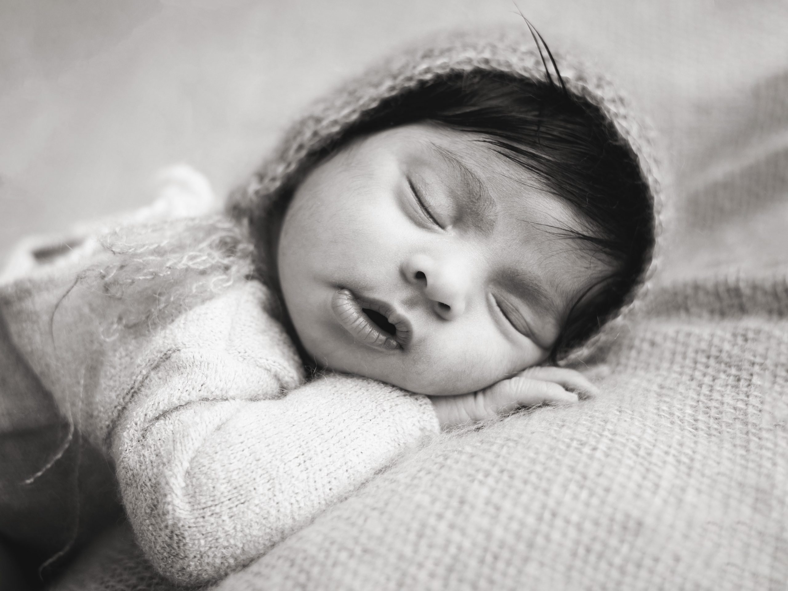 newborn baby girl wearing bonnet by Newborn Photographer In Great Finborough, Near Stowmarket, Ipswich & Bury St Edmunds
