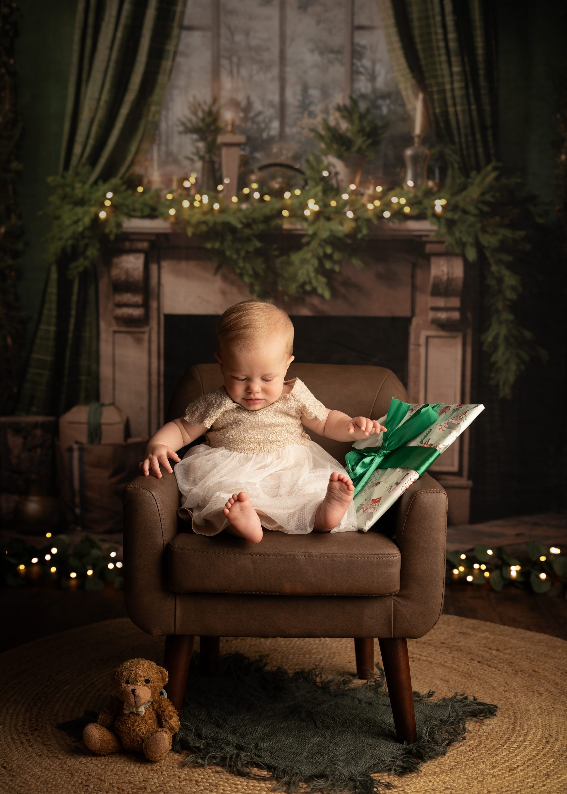 baby girl sitting by the fire at Christmas